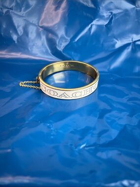 Coach, gold hinged bracelet